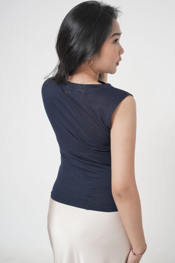 Effortlessly elegant, the Aura Drape shirt enhances your natural silhouette with its sculpted fit and graceful draped neckline