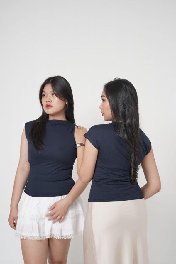 Effortlessly elegant, the Aura Drape shirt enhances your natural silhouette with its sculpted fit and graceful draped neckline